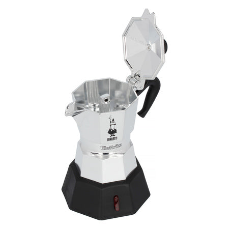 Bialetti New Moka Elettrika vist med åbent låg, der afslører brygkammeret – let elektrisk espressokande perfekt til rejser og kontor.